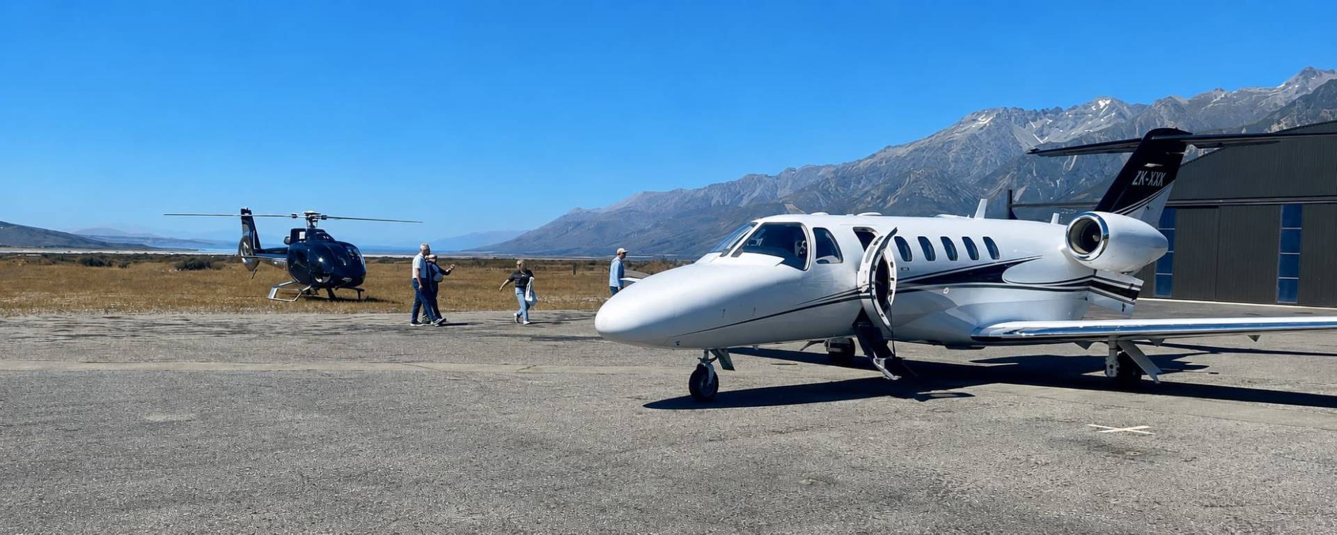 Passengers boarding an INFLITE private jet at Mt Cook