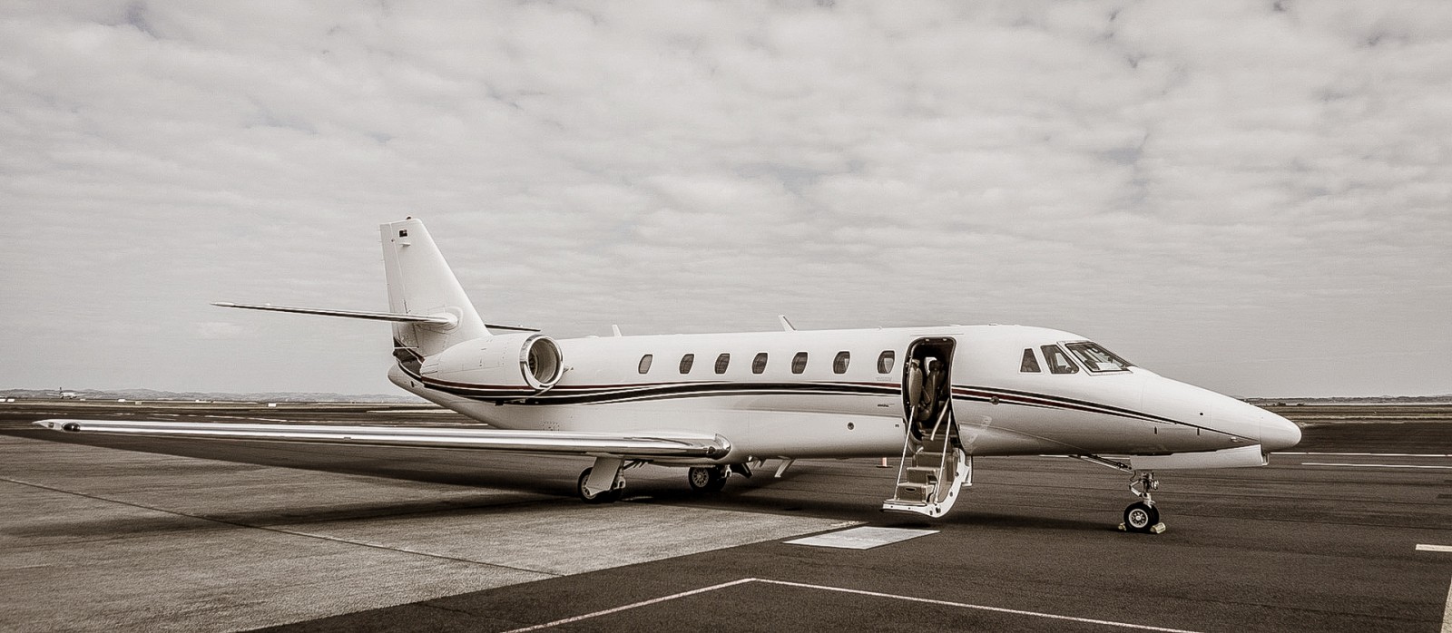 A helicopter and a plane on a runway in Auckland