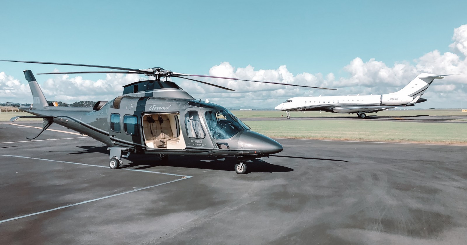 A helicopter and a plane on a runway in Auckland